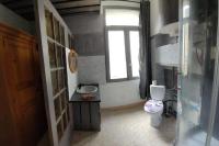 a small bathroom with a toilet and a window at Gite de la tour, proche Nîmes ,Avignon in Montfrin