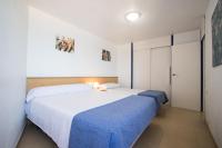 Posteľ alebo postele v izbe v ubytovaní Apartamentos Torre Yago