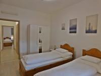 Posteľ alebo postele v izbe v ubytovaní Berki Apartman
