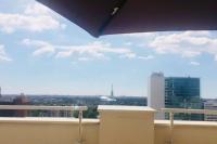 a view of a city skyline from a building at Beautiful apartment with Eiffel tower view in Puteaux