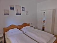 Posteľ alebo postele v izbe v ubytovaní Berki Apartman