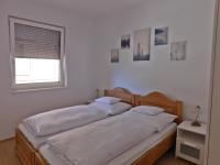 Posteľ alebo postele v izbe v ubytovaní Berki Apartman
