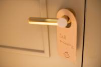 a door handle with a sign that readsself succeeding at The Melegran in Rovinj
