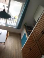 a kitchen with a table and a large window at Baie de Somme, Quend-Plage, 50m de plage, appart 4 a 6 personnes in Quend