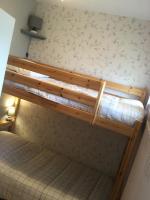 a couple of bunk beds in a room at Baie de Somme, Quend-Plage, 50m de plage, appart 4 a 6 personnes in Quend