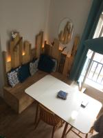a living room with a couch and a table at Baie de Somme, Quend-Plage, 50m de plage, appart 4 a 6 personnes in Quend