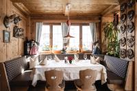 a dining room with a table and chairs at Hotel Ladinia in La Villa