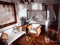 a living room with a couch and chairs and a bed at Fennel Resort in Checheng