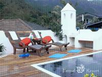 a patio with chairs and a table next to a pool at Fennel Resort in Checheng