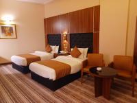 Royal Qatar Hotelにあるベッド
