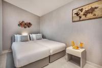 Posteľ alebo postele v izbe v ubytovaní Pefki Deluxe Residences