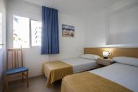 Posteľ alebo postele v izbe v ubytovaní Apartamentos Torre Yago