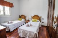 Postel nebo postele na pokoji v ubytování Villa Mirador Los Hoyos