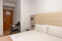 Posteľ alebo postele v izbe v ubytovaní Hotel Queens - Adults Only