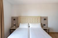 Posteľ alebo postele v izbe v ubytovaní Hotel Queens - Adults Only