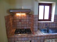 A kitchen or kitchenette at Diving Center Punta Stilo