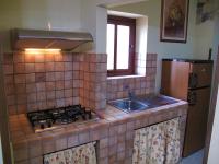 A kitchen or kitchenette at Diving Center Punta Stilo