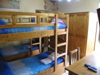 A bed or beds in a room at Diving Center Punta Stilo
