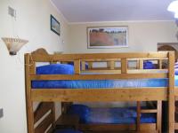 A bed or beds in a room at Diving Center Punta Stilo