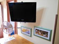 A television and/or entertainment centre at Diving Center Punta Stilo