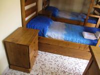 A bed or beds in a room at Diving Center Punta Stilo