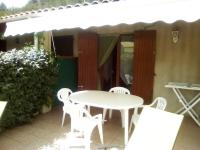 a white table and chairs on a patio at Le seringat 46 in Saint-Martin-de-Brômes