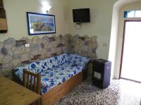 A bed or beds in a room at Diving Center Punta Stilo