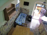 A television and/or entertainment centre at Diving Center Punta Stilo