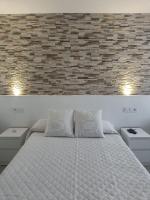 A bed or beds in a room at Alojamientos La Menúa