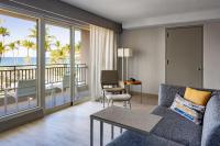 a living room with a couch and a view of the ocean at San Juan Marriott Resort and Stellaris Casino in San Juan