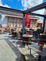 a patio at a restaurant with tables and chairs at Gasthaus Stroh in Buchholz