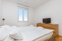 Postel nebo postele na pokoji v ubytování Nest Apartment