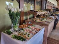 a buffet line with many different types of food at Aparthotel Góralski Spa & Restaurant in Białka Tatrzanska