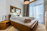 Posteľ alebo postele v izbe v ubytovaní TATRA SUITES Vila HIMALAYA