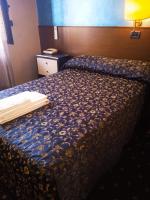 A bed or beds in a room at Hotel Parco Fiera