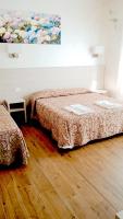 A bed or beds in a room at Hotel Parco Fiera