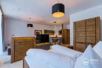 Posteľ alebo postele v izbe v ubytovaní TATRA SUITES Vila HIMALAYA