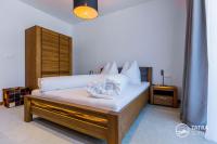 Posteľ alebo postele v izbe v ubytovaní TATRA SUITES Vila HIMALAYA