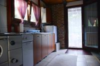 a kitchen with a sink and a dishwasher at Kuća za odmor Čanić gaj in Gospić