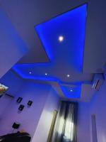a ceiling with a blue light in a room at jolie maison individuelle 50 m2 ,design et climatisée, tout confort, wifi, terasse privée , 5 min plage et autoroute, stationnement gratuit in Marseille