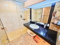 a bathroom with a sink and a shower at 恆春古城親子民宿 in Hengchun South Gate