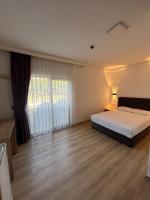 Postel nebo postele na pokoji v ubytování Asimado Hotel