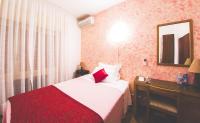 Posteľ alebo postele v izbe v ubytovaní Quari Hotel Restaurant & Pizza