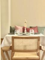 a table with a plate and two glasses on it at Thymises Boutique Hotel in Kakopetria