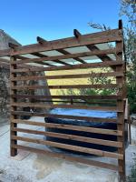 a wooden fence with a mattress in it at Maison Amandre en Pleine Nature - Mas Lou Castanea in Collobrières