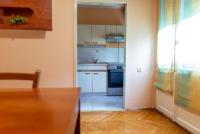 a kitchen with white appliances and a table in a room at Apartment Duje in Split