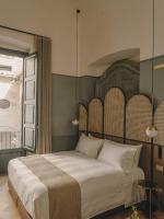 Hotel Palau Fugitにあるベッド