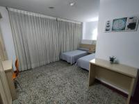A bed or beds in a room at Hotel Cogullada