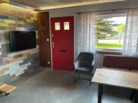 Televízia a/alebo spoločenská miestnosť v ubytovaní Atelier Houses