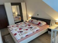 Posteľ alebo postele v izbe v ubytovaní Apartmani G&E